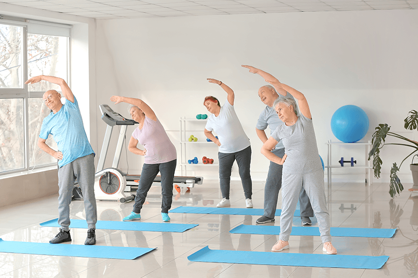 elderly people exercising 